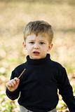 boy eating short stick