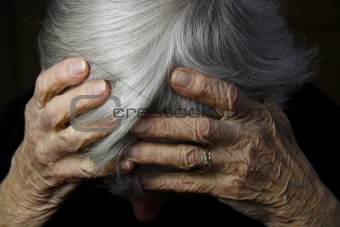 old woman with a very bad headache
