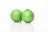 two green ornaments isolated