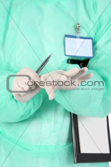 surgeon putting medical gloves on