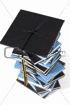 graduation cap and books