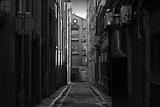 Looking down a long dark back alley