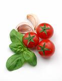 Red tomatoes, basil and garlic