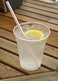 cup of refreshing ice cold water with lemon