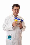 Laboratory chemist holding bottles of chemicals