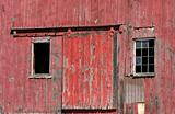 Old red barn door with windows