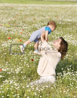happy woman playing with her son