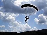 Parachutist on a cloudy sky