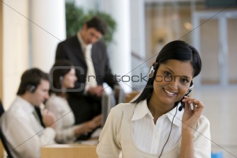 Young smiling woman in office environment