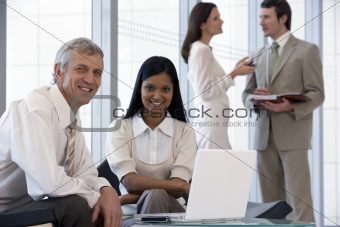 Smiling business people in office