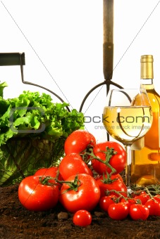 Fresh tomatoes, lettuce and wine