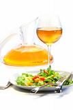 Plate of salad and wine glass