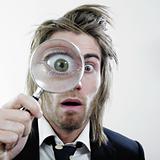 Man holding magnifying glass