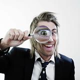 Happy man with magnifying lens