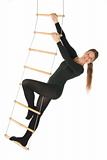 Woman on a rope ladder