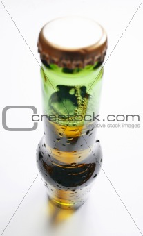 Wide angle shot of bottle of beer on white background