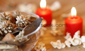 Dried plants and burning candles