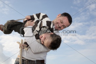 young father playing with his son