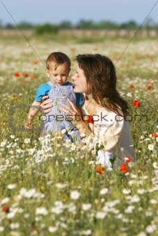 mother and son in flowers