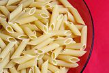 Pasta on red background