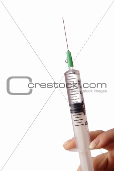 Hand holding syringe.Isolated on white background.