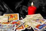 Tarot cards and burning candle