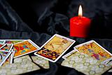 Tarot cards and burning candle