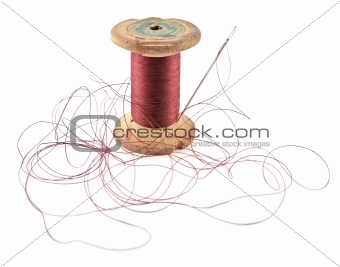 Old thread and needle isolated on white