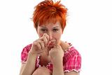 Crying young red haired woman isolaited on white background