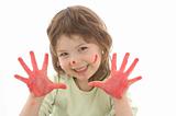 cute girl with painted hands and face