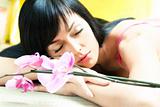 Asian girl with orchid