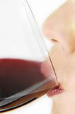 woman drinking red wine closeup