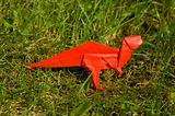 origami dinosaur on grass