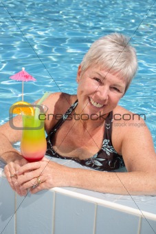 attractive woman relaxing by the pool