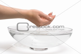 Woman's hands scooping fresh water