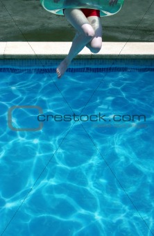 Young woman jumping in swimming pool