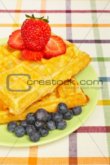 Waffles, blueberries and strawberries