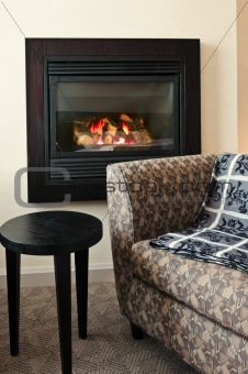 Fireplace and armchair