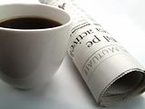 Cup of coffee and newspaper