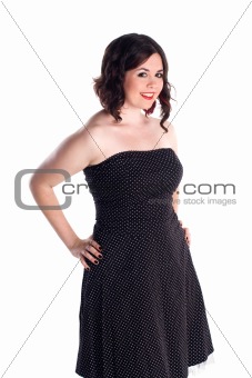 cute girl in polka dot dress in pin-up pose