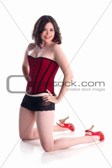 cute girl in red corset in pin-up pose