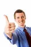 Young businessman showing thumb up and smile. Sign "Yes"