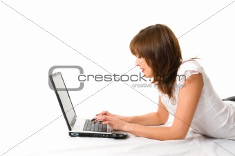 Young japanese businesswoman with laptop lying on the floor