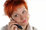 red haired woman talking by mobile phone unhappy