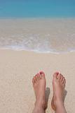 Feet at sea shore