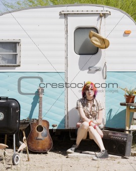 Girl Sitting on a Trailer Step