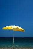 Yellow parasol on beach