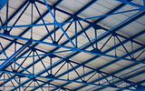 white-blue geometric ceiling of stadium tribune