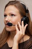Pretty customer support girl with headset, listening to customer