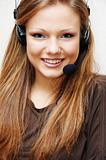 Young and pretty customer support woman with headset.